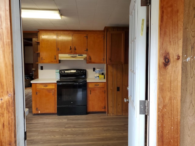 kitchen featuring light hardwood / wood-style flooring and electric range