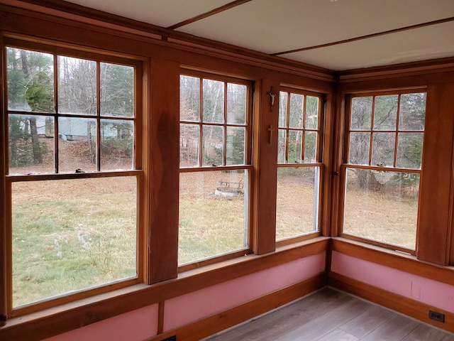 unfurnished sunroom with a healthy amount of sunlight