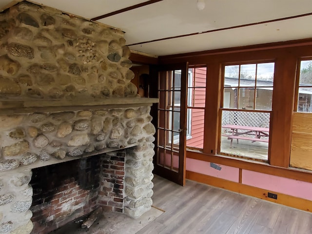 details with hardwood / wood-style floors and a fireplace