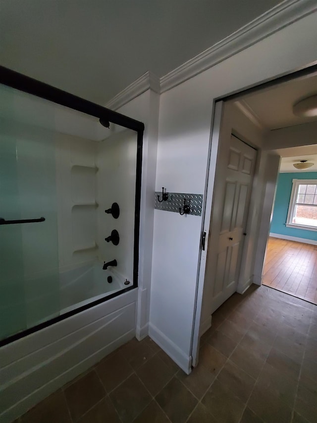 bathroom with wood-type flooring, bathing tub / shower combination, and crown molding