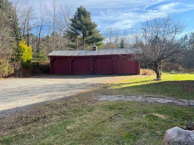 view of outdoor structure with a yard