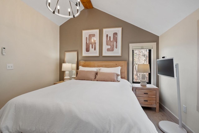 bedroom with hardwood / wood-style flooring, vaulted ceiling with beams, and a notable chandelier