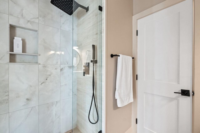 bathroom with a tile shower