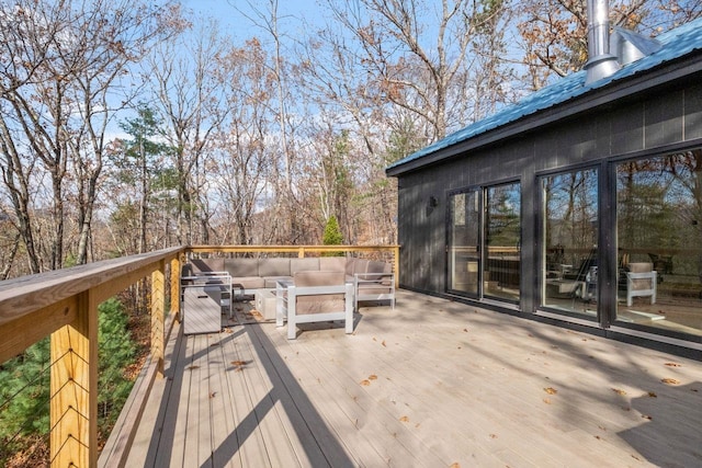 wooden terrace featuring outdoor lounge area