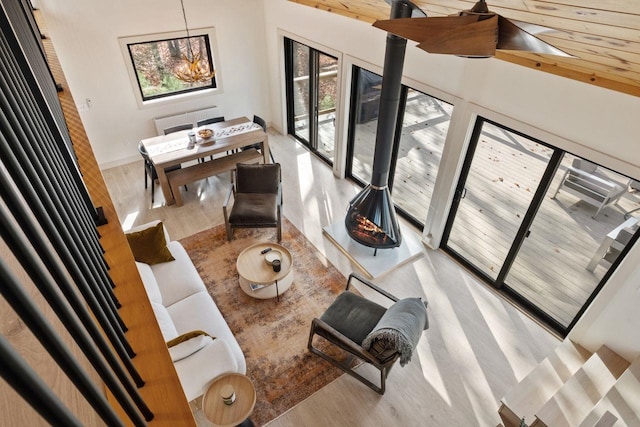 living room with wood ceiling and light hardwood / wood-style floors