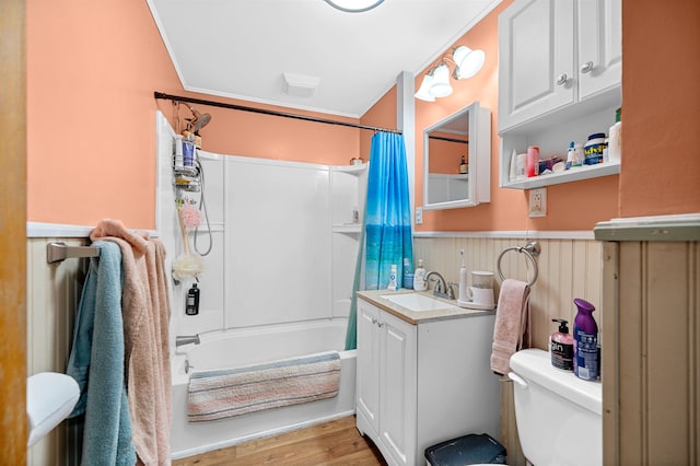 full bathroom featuring shower / tub combo with curtain, vanity, toilet, and hardwood / wood-style floors