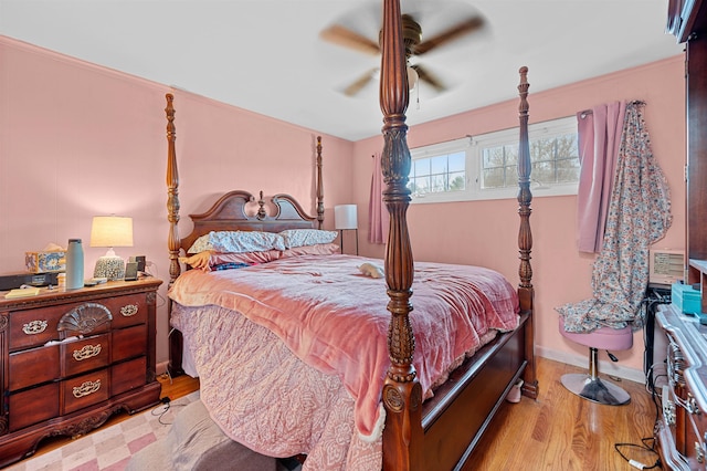 bedroom with ceiling fan and light hardwood / wood-style flooring