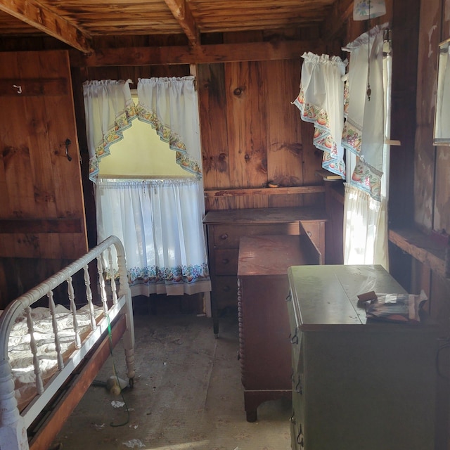 bedroom with wood walls