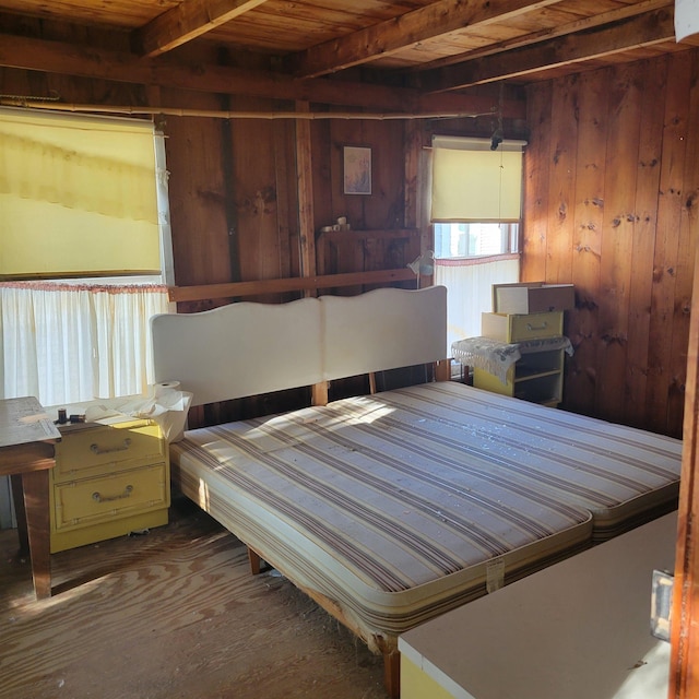 unfurnished bedroom featuring wood ceiling, dark wood-type flooring, beamed ceiling, and wood walls