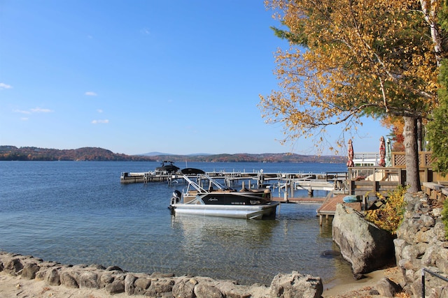 view of dock featuring a water and mountain view