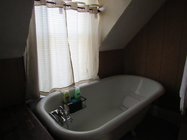 bathroom featuring a washtub