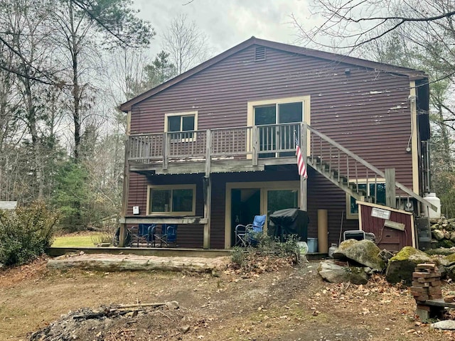 back of house with a balcony