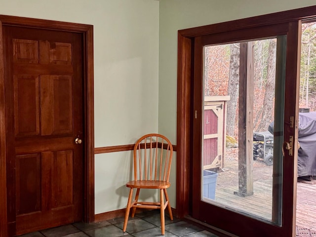 doorway with light tile patterned floors