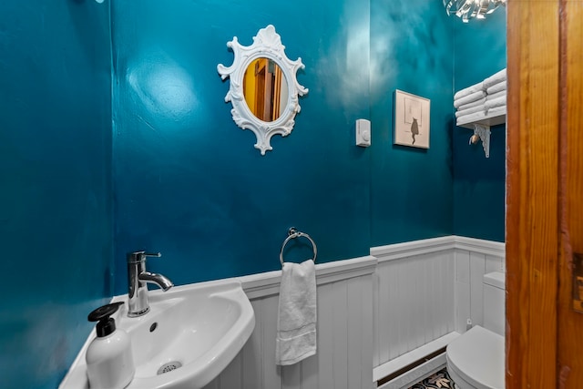 bathroom featuring sink and toilet