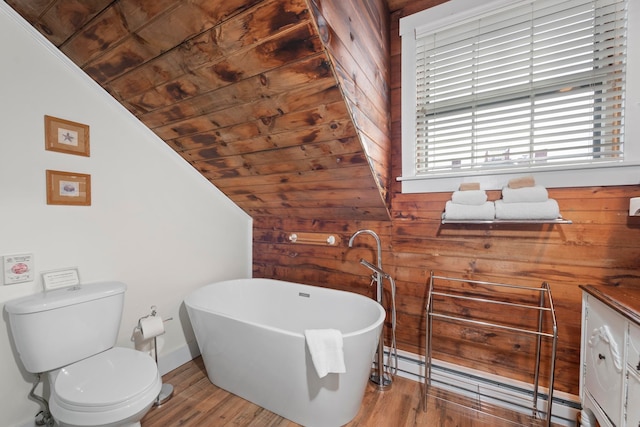 bathroom with wooden ceiling, hardwood / wood-style flooring, a bathing tub, lofted ceiling, and a baseboard radiator