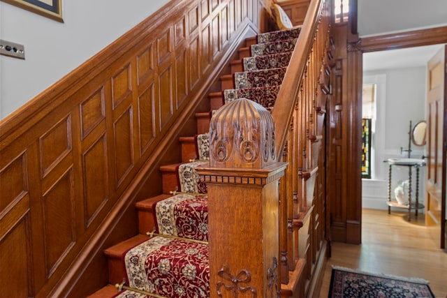 stairway featuring wood-type flooring