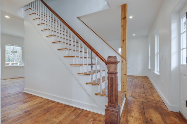 staircase featuring hardwood / wood-style floors