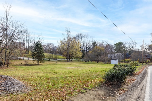 view of yard with a rural view