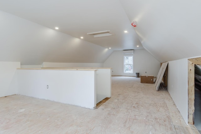 additional living space featuring vaulted ceiling