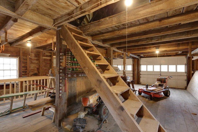 interior space with beamed ceiling, hardwood / wood-style flooring, and wooden ceiling