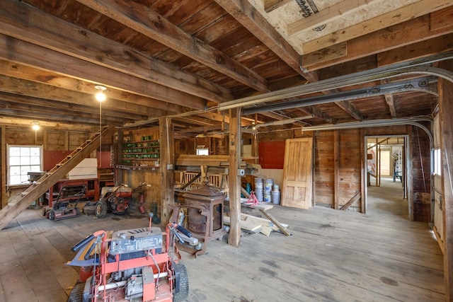 interior space with wood walls and wood-type flooring