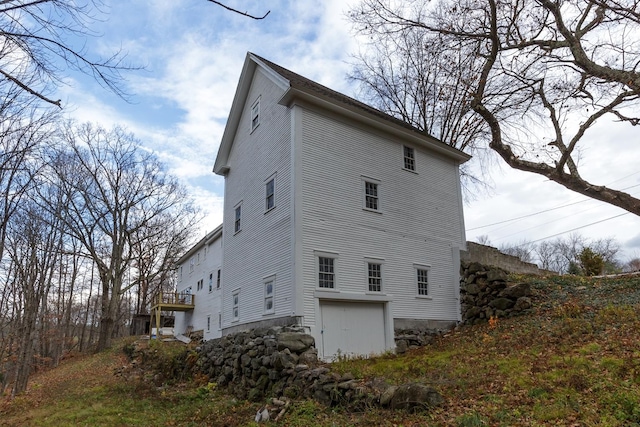 view of property exterior featuring a garage