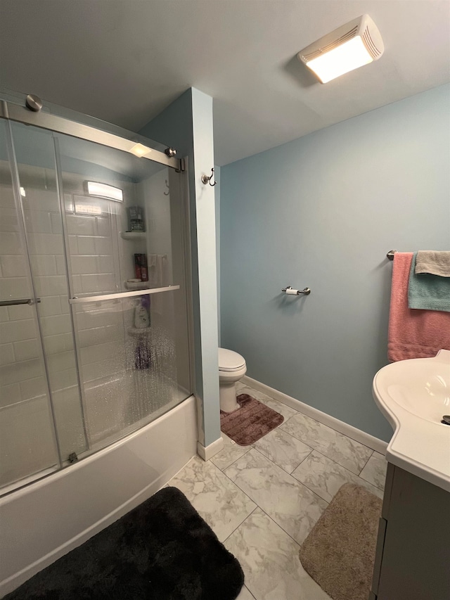 full bathroom with vanity, enclosed tub / shower combo, and toilet