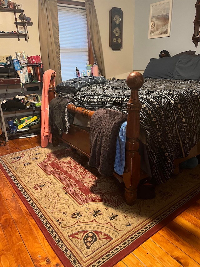 bedroom featuring hardwood / wood-style flooring