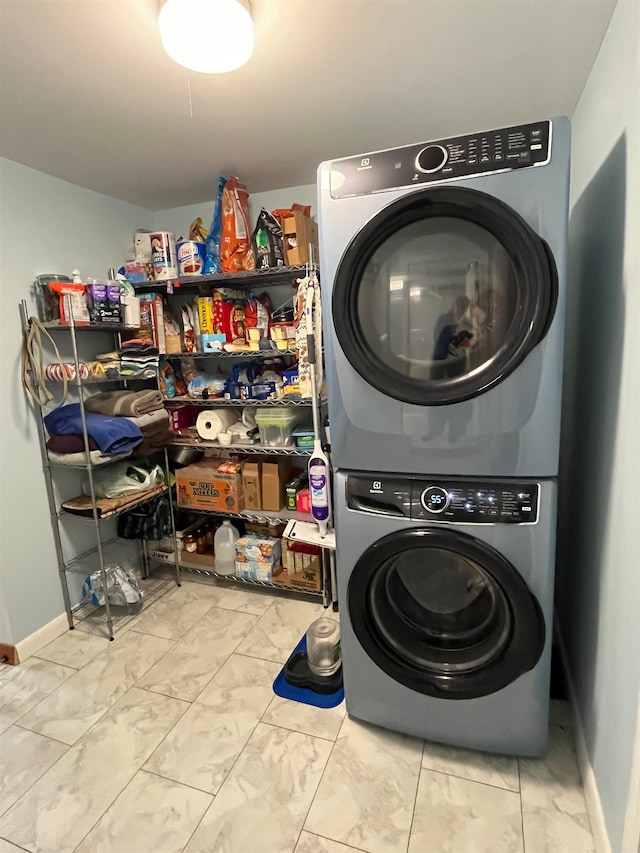 laundry area featuring stacked washer and dryer