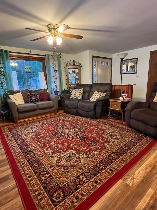 living room with ceiling fan and hardwood / wood-style flooring