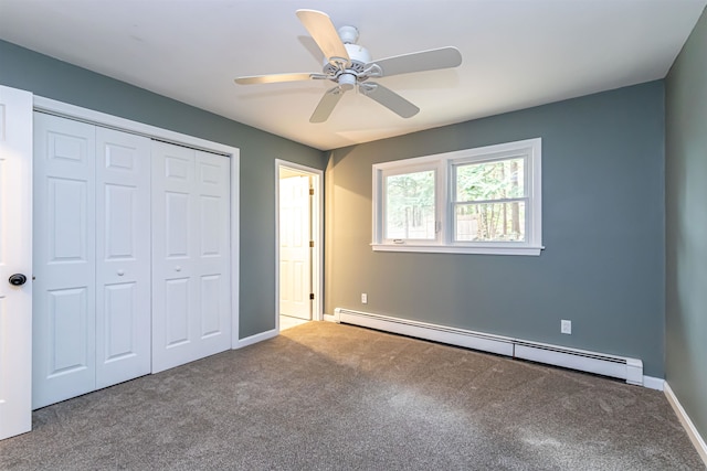 unfurnished bedroom with ceiling fan, carpet flooring, a closet, and a baseboard heating unit