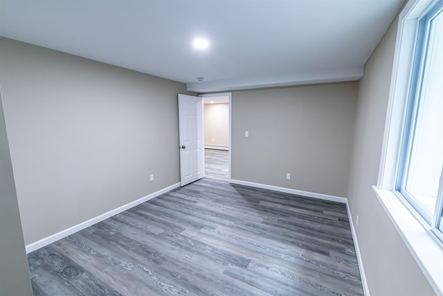 spare room featuring dark hardwood / wood-style flooring