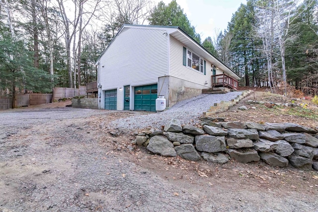 view of side of property featuring a garage