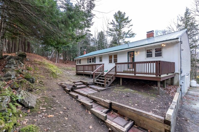 rear view of property with a deck