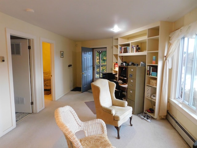 sitting room with light colored carpet and a baseboard radiator