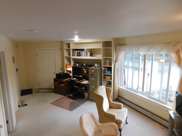 carpeted office space featuring a baseboard radiator