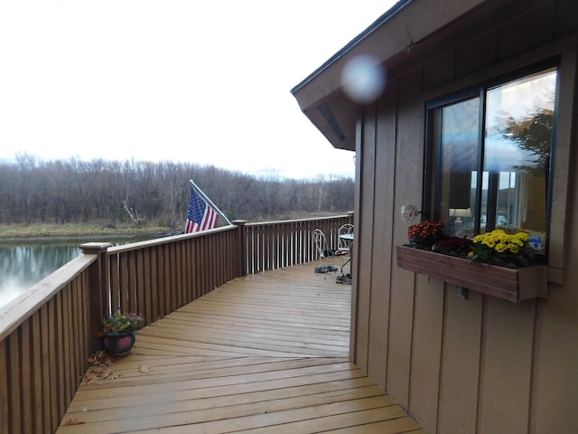 wooden terrace with a water view