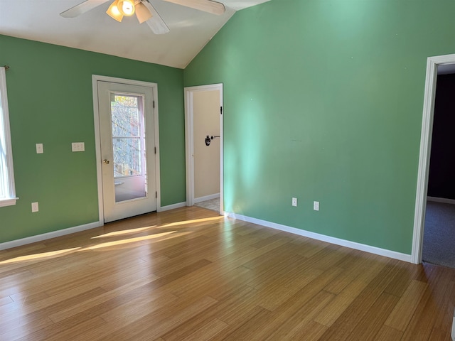 interior space with ceiling fan, light hardwood / wood-style flooring, and vaulted ceiling