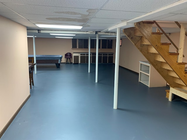 basement featuring a drop ceiling and billiards