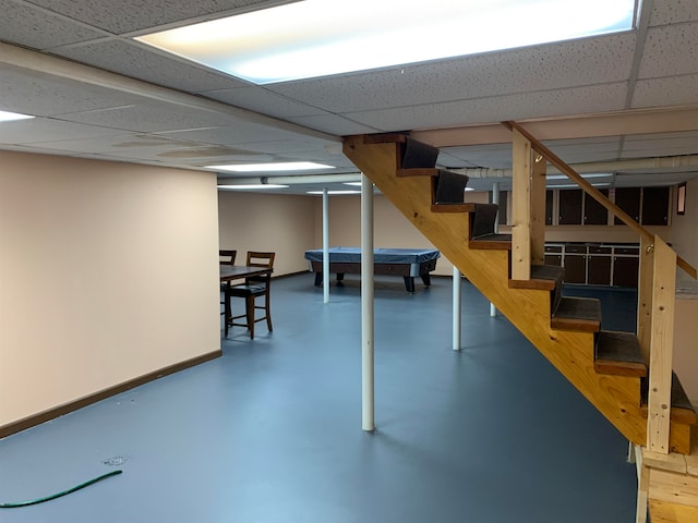 basement featuring a drop ceiling