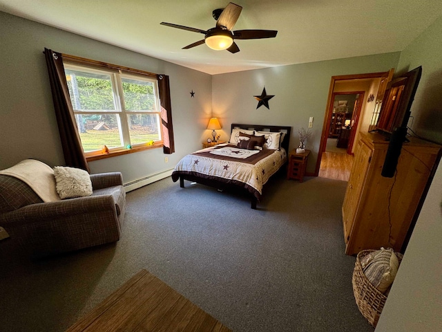 carpeted bedroom featuring ceiling fan and baseboard heating