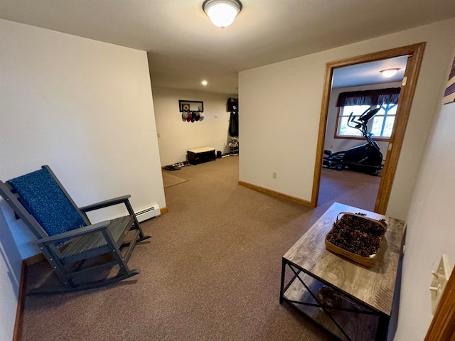 hallway featuring a baseboard radiator and light carpet