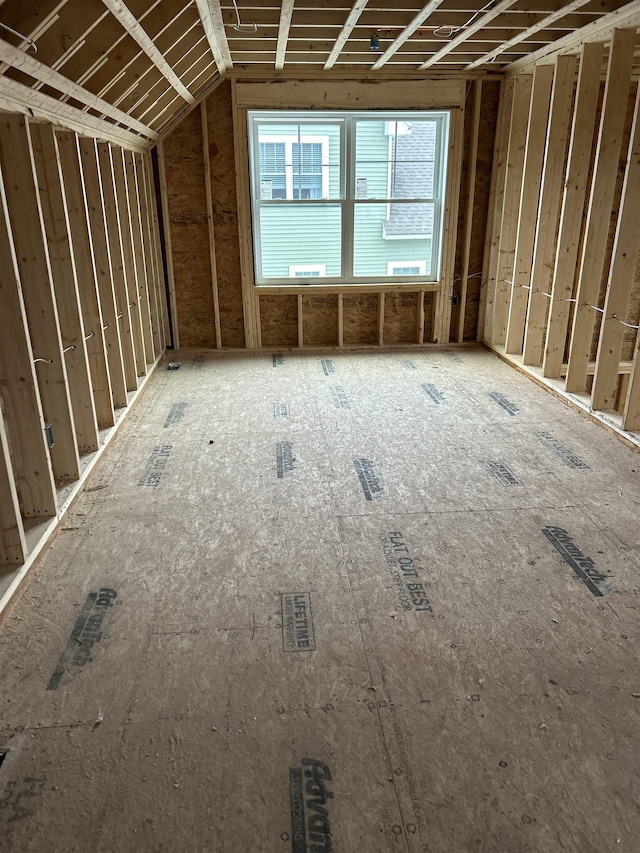 miscellaneous room with lofted ceiling