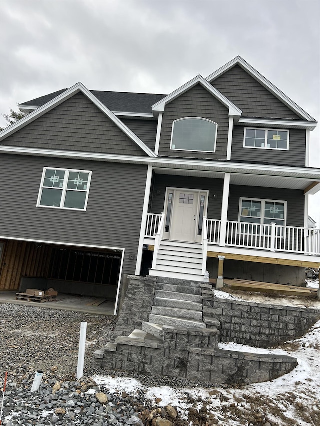 view of front of house with a garage and covered porch