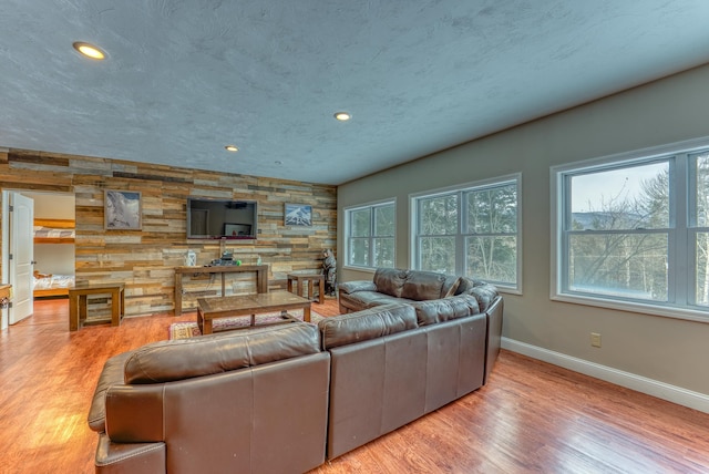 living room featuring hardwood / wood-style flooring and a textured ceiling