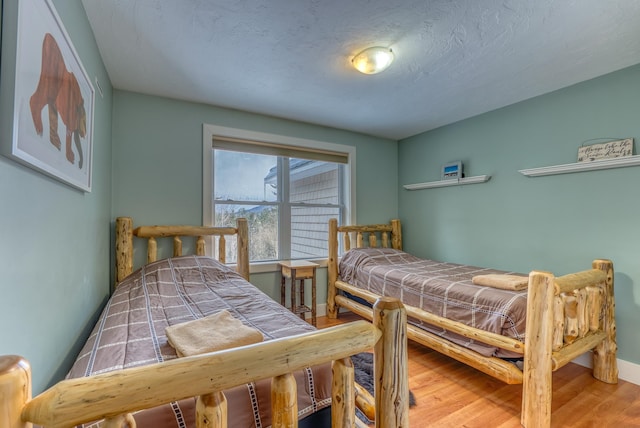 bedroom featuring hardwood / wood-style flooring