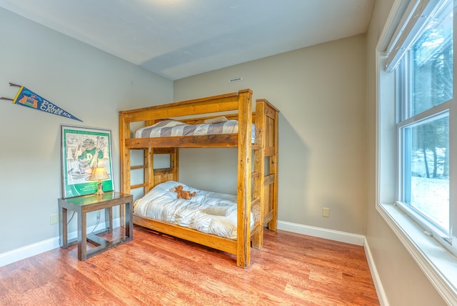 bedroom with hardwood / wood-style flooring