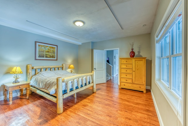 bedroom with light wood-type flooring