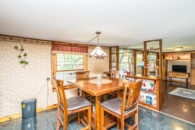 dining space featuring dark hardwood / wood-style floors