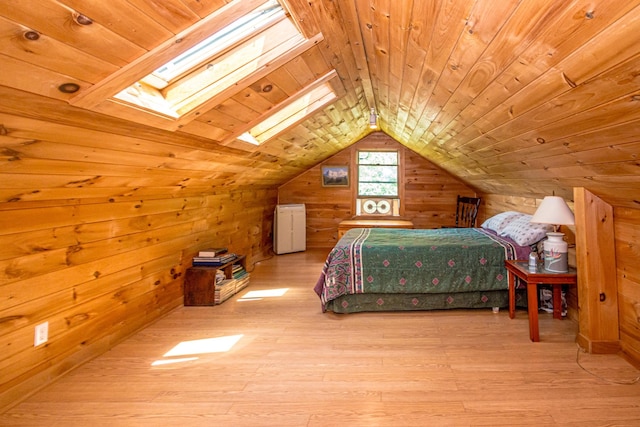 bedroom featuring wood walls, light hardwood / wood-style floors, wood ceiling, and lofted ceiling with skylight